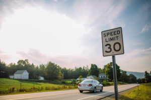 30 mph speed limit sign on the road