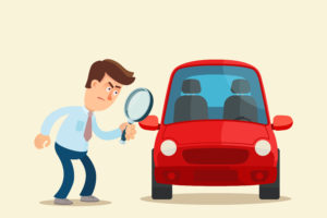 cartoon of a man examining his car with a magnifying glass