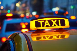 taxicab with sign lit