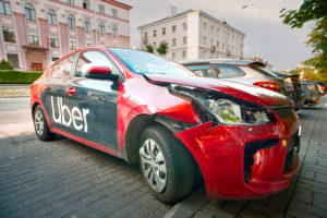 damaged red uber car