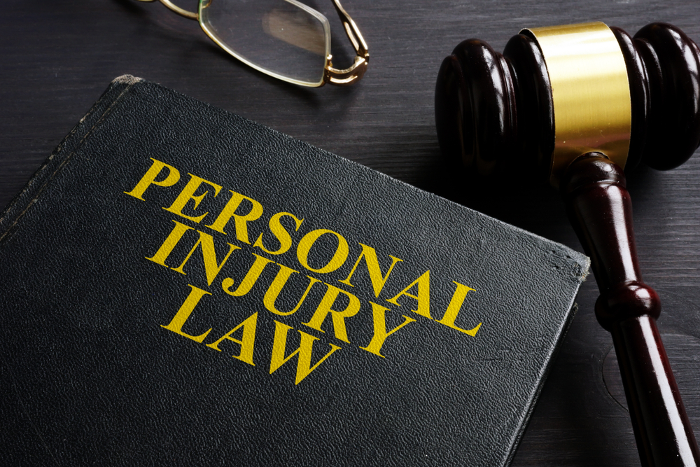 Photo of gavel and book that says personal injury law